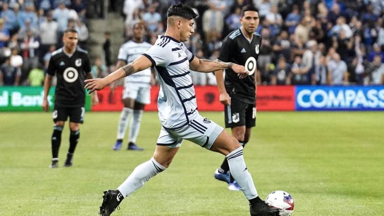 Oct 21, 2023; Kansas City, Kansas, USA; Sporting Kansas City forward Alan Pulido (9) dribbles the ball against Minnesota United during the second half at Children's Mercy Park. Mandatory Credit: Denny Medley-USA TODAY Sports