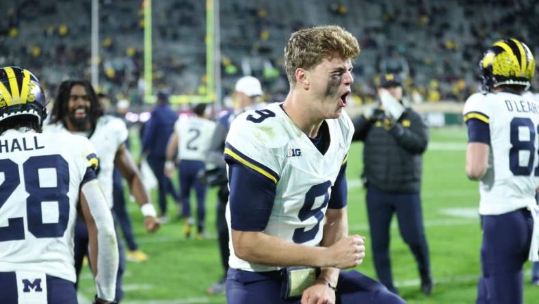 Michigan Wolverines quarterback J.J. McCarthy (9) celebrates after a touchdown against the Michigan State Spartans during second-half action at Spartan Stadium in East Lansing on Saturday, Oct. 21, 2023.