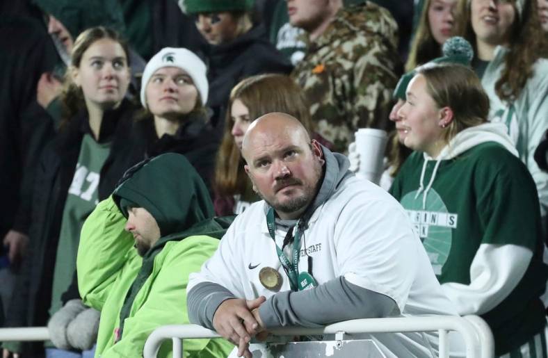 A Michigan State fan in the stands during the second half of the Spartans' 49-0 loss to the Michigan Wolverines at Spartan Stadium in East Lansing on Saturday, Oct. 21, 2023.