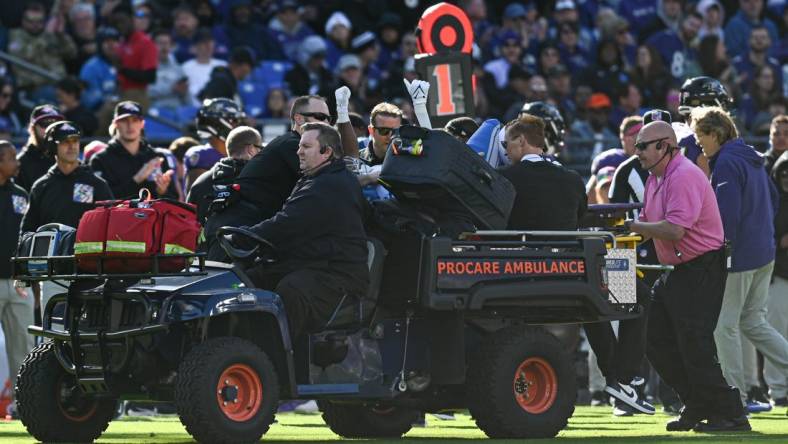 Oct 22, 2023; Baltimore, Maryland, USA;  Detroit Lions running back Mohamed Ibrahim (35) raises his hands as he is carted off the field during the second half against the Baltimore Ravens at M&T Bank Stadium. Mandatory Credit: Tommy Gilligan-USA TODAY Sports