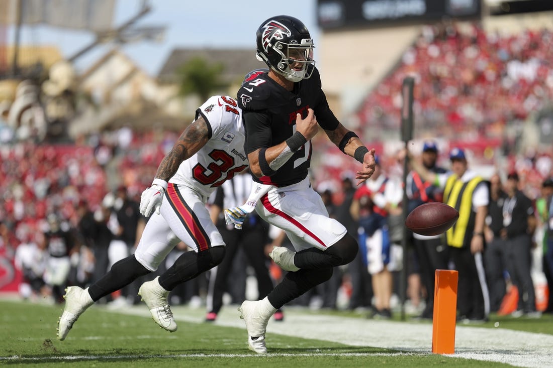 Oct 22, 2023; Tampa, Florida, USA;  Tampa Bay Buccaneers safety Antoine Winfield Jr. (31) forces a fumble by Atlanta Falcons quarterback Desmond Ridder (9) at the goal line in the fourth quarter at Raymond James Stadium. Mandatory Credit: Nathan Ray Seebeck-USA TODAY Sports