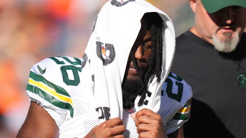 Oct 22, 2023; Denver, Colorado, USA; Green Bay Packers safety Darnell Savage (26) leaves the filed in the second quarter against the Denver Broncos at Empower Field at Mile High. Mandatory Credit: Ron Chenoy-USA TODAY Sports