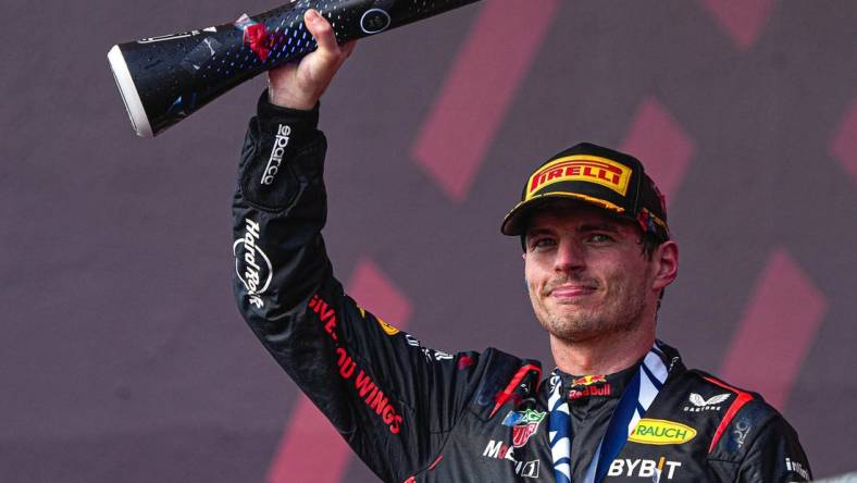 Oracle Red Bull Racing driver Max Verstappen hoists the trophy after winning the Formula 1 Lenovo United States Grand Prix at Circuit of Americas on Sunday Oct. 22, 2023.