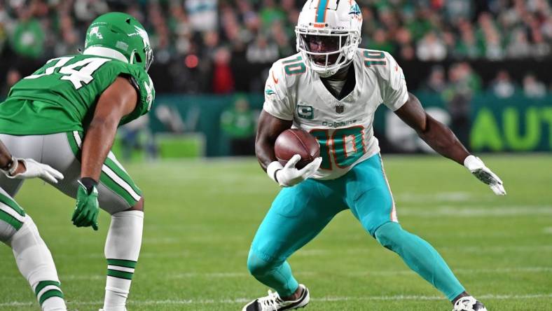 Oct 22, 2023; Philadelphia, Pennsylvania, USA; Miami Dolphins wide receiver Tyreek Hill (10) is stopped  by Philadelphia Eagles cornerback Josiah Scott (34) first quarter at Lincoln Financial Field. Mandatory Credit: Eric Hartline-USA TODAY Sports