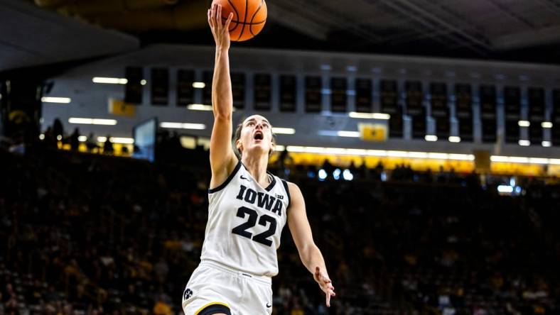 Iowa guard Caitlin Clark (22) makes a basket during a NCAA women's basketball exhibition game between Iowa and Clarke University, Sunday, Oct. 22, 2023, at Carver-Hawkeye Arena in Iowa City.