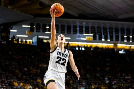 Iowa guard Caitlin Clark (22) makes a basket during a NCAA women's basketball exhibition game between Iowa and Clarke University, Sunday, Oct. 22, 2023, at Carver-Hawkeye Arena in Iowa City.
