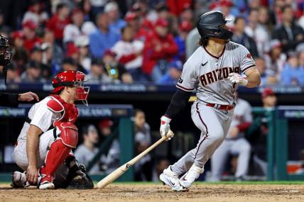 Oct 23, 2023; Philadelphia, Pennsylvania, USA; Arizona Diamondbacks center fielder Alek Thomas (5) hits a single during the sixth inning against the Philadelphia Phillies in game six of the NLCS for the 2023 MLB playoffs at Citizens Bank Park. Mandatory Credit: Bill Streicher-USA TODAY Sports