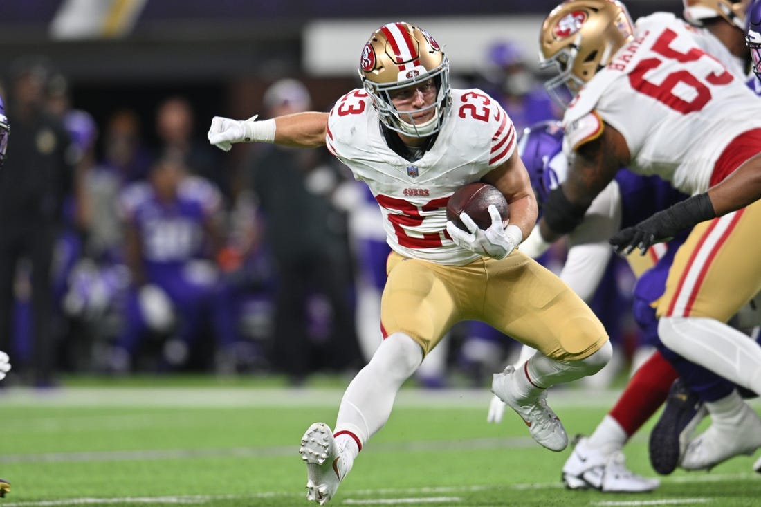 Oct 23, 2023; Minneapolis, Minnesota, USA; San Francisco 49ers running back Christian McCaffrey (23) runs the ball against the Minnesota Vikings during the first quarter at U.S. Bank Stadium. Mandatory Credit: Jeffrey Becker-USA TODAY Sports