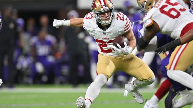 Oct 23, 2023; Minneapolis, Minnesota, USA; San Francisco 49ers running back Christian McCaffrey (23) runs the ball against the Minnesota Vikings during the first quarter at U.S. Bank Stadium. Mandatory Credit: Jeffrey Becker-USA TODAY Sports