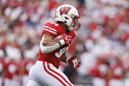 Oct 14, 2023; Madison, Wisconsin, USA;  Wisconsin Badgers running back Jackson Acker (34) during the game against the Iowa Hawkeyes at Camp Randall Stadium. Mandatory Credit: Jeff Hanisch-USA TODAY Sports