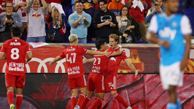 Oct 25, 2023; Harrison, NJ, USA; New York Red Bulls forward Tom Barlow (74) celebrates with midfielder Omir Fernandez (21) after scoring a goal against Charlotte FC during the second half in the Eastern Conference Wild Card match of the 2023 MLS Cup Playoffs at Red Bull Arena. Mandatory Credit: Vincent Carchietta-USA TODAY Sports