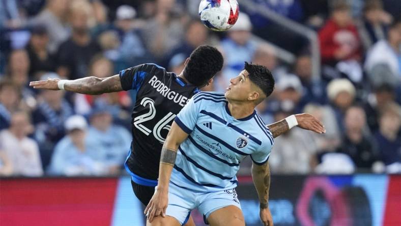 Oct 25, 2023; Kansas City, KS, USA; Sporting Kansas City forward Alan Pulido (9) battles San Jose Earthquakes defender Rodrigues (26) for the ball in the second half in the Western Conference Wild Card match of the 2023 MLS Cup Playoffs at Children's Mercy Park. Mandatory Credit: Jay Biggerstaff JB-USA TODAY Sports