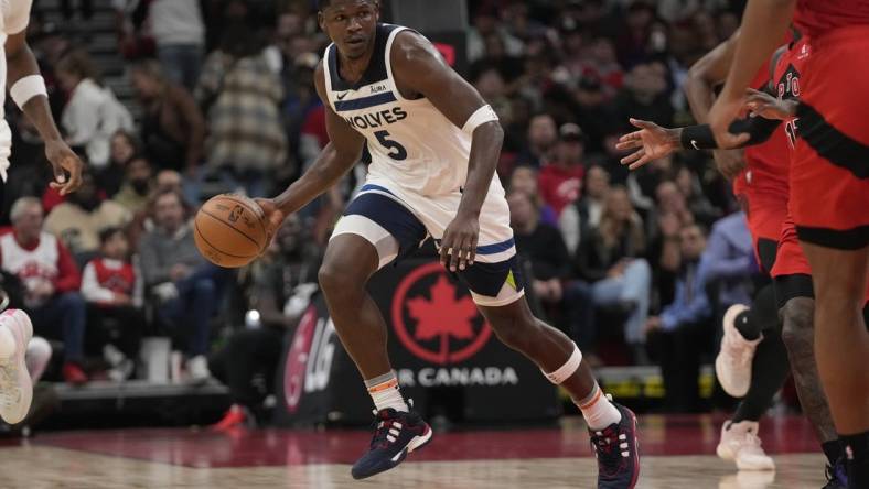 Oct 25, 2023; Toronto, Ontario, CAN; Minnesota Timberwolves guard Anthony Edwards (5) dribbles the ball against the Toronto Raptors during the first half at Scotiabank Arena. Mandatory Credit: John E. Sokolowski-USA TODAY Sports