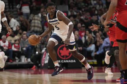 Oct 25, 2023; Toronto, Ontario, CAN; Minnesota Timberwolves guard Anthony Edwards (5) dribbles the ball against the Toronto Raptors during the first half at Scotiabank Arena. Mandatory Credit: John E. Sokolowski-USA TODAY Sports