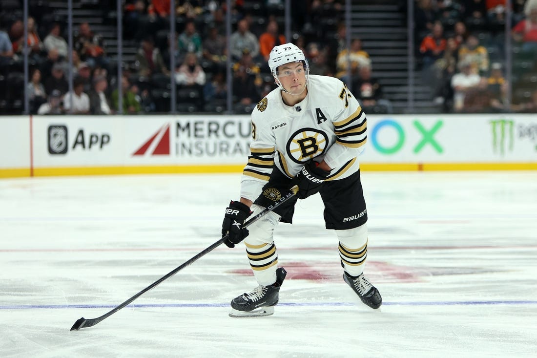 Oct 22, 2023; Anaheim, California, USA;  Boston Bruins defenseman Charlie McAvoy (73) skates with the puck during the NHL game against the Anaheim Ducks at Honda Center. Mandatory Credit: Kiyoshi Mio-USA TODAY Sports