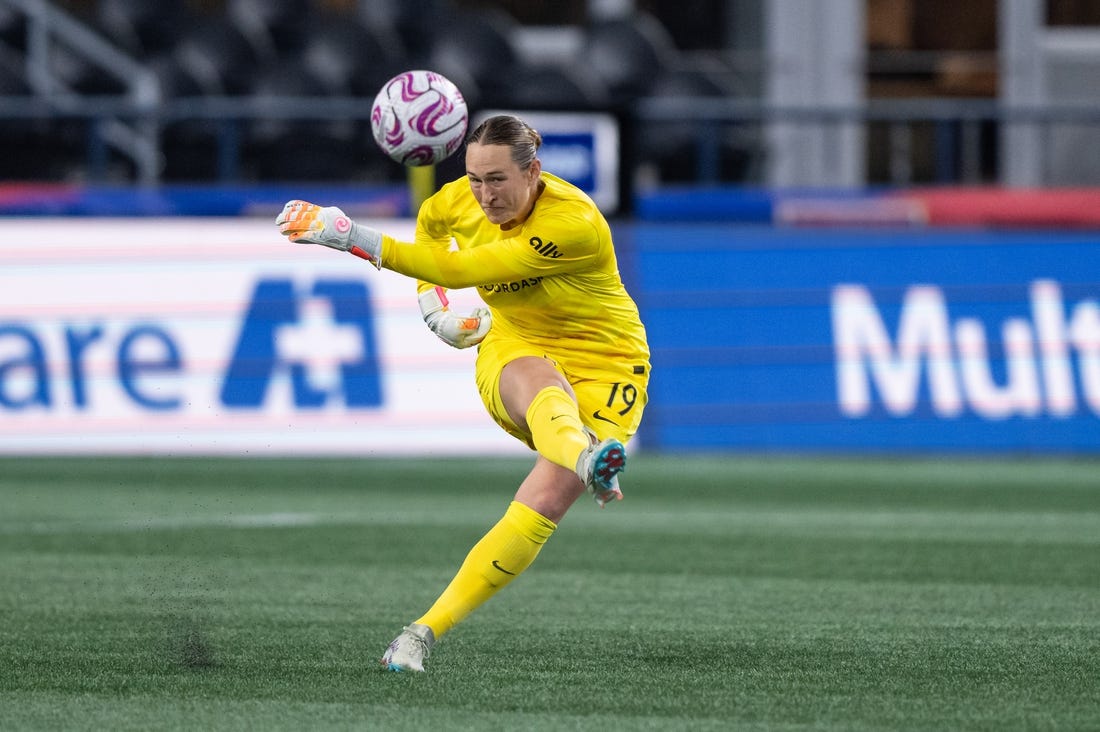 Oct 20, 2023; Seattle, Washington, USA; Angel City FC goalkeeper Angelina Anderson (19) clears the ball against OL Reign at Lumen Field. Mandatory Credit: Stephen Brashear-USA TODAY Sports