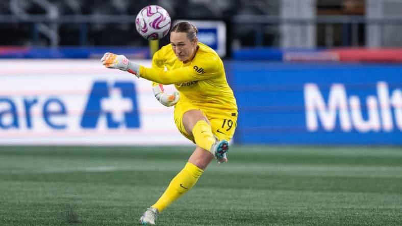 Oct 20, 2023; Seattle, Washington, USA; Angel City FC goalkeeper Angelina Anderson (19) clears the ball against OL Reign at Lumen Field. Mandatory Credit: Stephen Brashear-USA TODAY Sports