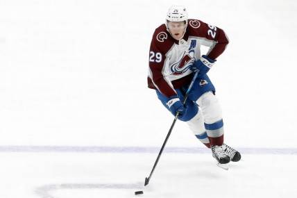 Oct 26, 2023; Pittsburgh, Pennsylvania, USA; Colorado Avalanche center Nathan MacKinnon (29) skates up ice with the puck against the Pittsburgh Penguins during the second period at PPG Paints Arena. The Penguins shutout the Avalanche 4-0. Mandatory Credit: Charles LeClaire-USA TODAY Sports