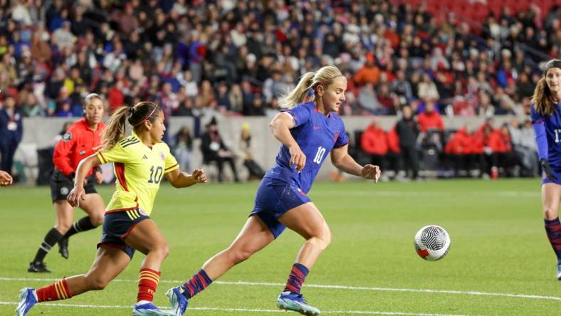 Oct 26, 2023; Sandy, Utah, USA;  United States midfielder Lindsey Horan (10) keeps the ball away from Colombia midfielder Leicy Santos (10) during the first half at America First Field. Mandatory Credit: Chris Nicoll-USA TODAY Sports