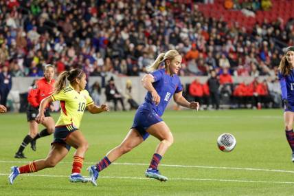 Oct 26, 2023; Sandy, Utah, USA;  United States midfielder Lindsey Horan (10) keeps the ball away from Colombia midfielder Leicy Santos (10) during the first half at America First Field. Mandatory Credit: Chris Nicoll-USA TODAY Sports