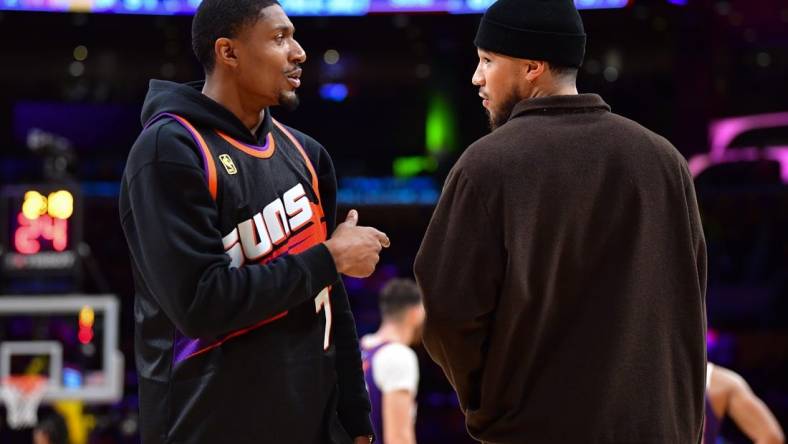 Oct 26, 2023; Los Angeles, California, USA; Phoenix Suns guard Bradley Beal (3) speaks with guard Devin Booker (1) during the second half at Crypto.com Arena. Mandatory Credit: Gary A. Vasquez-USA TODAY Sports