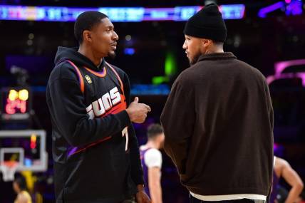 Oct 26, 2023; Los Angeles, California, USA; Phoenix Suns guard Bradley Beal (3) speaks with guard Devin Booker (1) during the second half at Crypto.com Arena. Mandatory Credit: Gary A. Vasquez-USA TODAY Sports