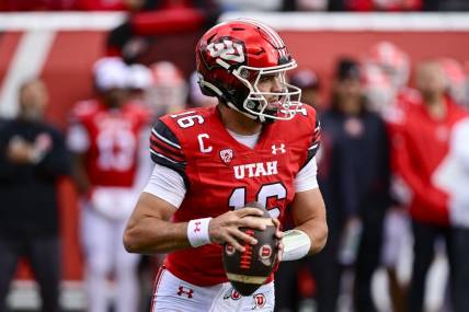 Oct 28, 2023; Salt Lake City, Utah, USA; Utah Utes quarterback Bryson Barnes (16) steps out of the pocket against the Oregon Ducks during the first half at Rice-Eccles Stadium. Mandatory Credit: Christopher Creveling-USA TODAY Sports