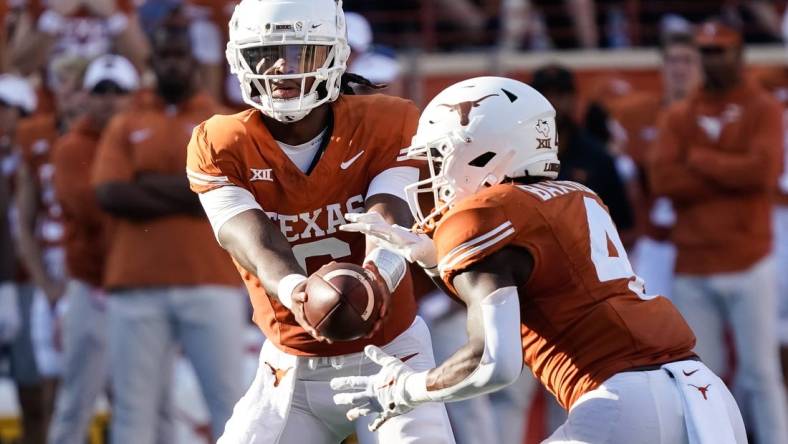 Oct 28, 2023; Austin, Texas, USA; Texas Longhorns quarterback Maalik Murphy (6) hands off to running back CJ Baxter (4) during the second half against the Brigham Young Cougars at Darrell K Royal-Texas Memorial Stadium. Mandatory Credit: Scott Wachter-USA TODAY Sports