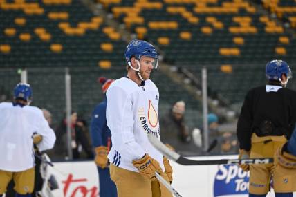 Oct 28, 2023; Edmonton, Alberta, Canada; EEdmonton Oilers centre Connor McDavid (97) hits the ice during practice day for the 2023 Heritage Classic ice hockey game at Commonwealth Stadium. Mandatory Credit: Walter Tychnowicz-USA TODAY Sports