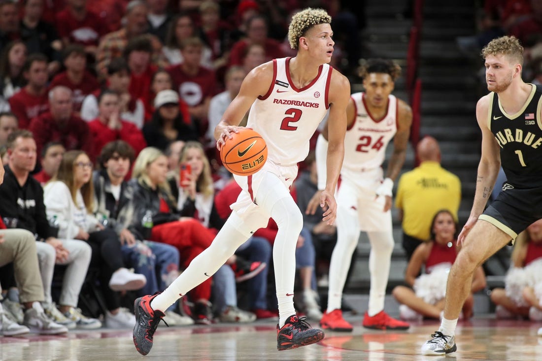 Arkansas Razorbacks forward Trevon Brazile (2) dribbles the ball against Purdue Boilermakers forward Caleb First (1) during the first half at Bud Walton Arena. Arkansas won 81-77. Mandatory Credit: Nelson Chenault-USA TODAY Sports