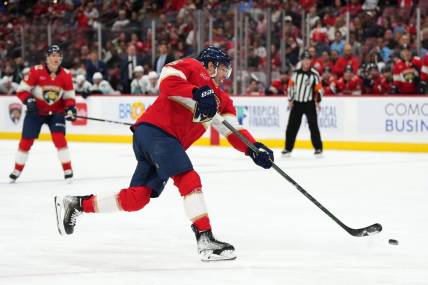 Oct 28, 2023; Sunrise, Florida, USA; Florida Panthers center Carter Verhaeghe (23) shoots the puck against the Seattle Kraken during the second period at Amerant Bank Arena. Mandatory Credit: Jasen Vinlove-USA TODAY Sports