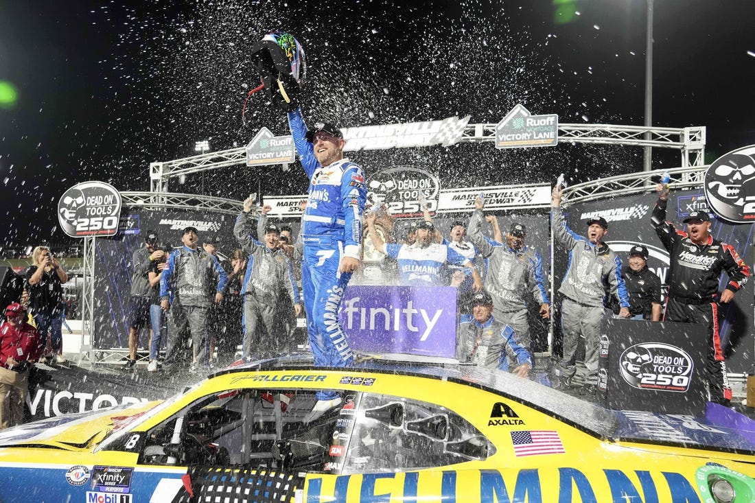 Oct 28, 2023; Martinsville, Virginia, USA; NASCAR Xfinity Series driver Justin Allgaier (7) celebrates after winning the Dead On Tools 250 at Martinsville Speedway. Mandatory Credit: David Yeazell-USA TODAY Sports