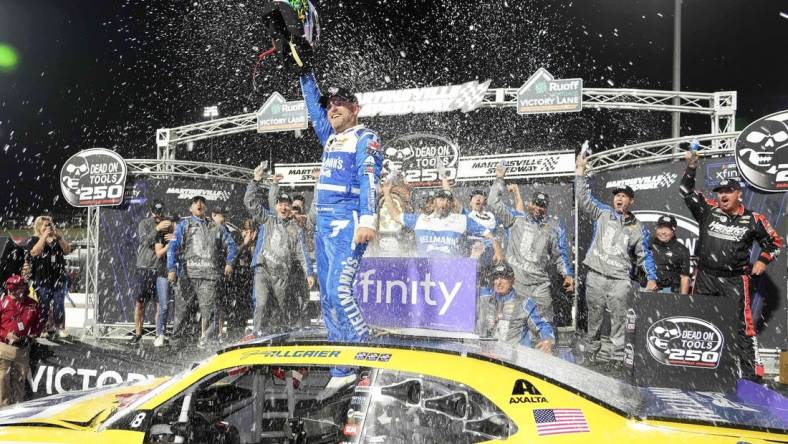 Oct 28, 2023; Martinsville, Virginia, USA; NASCAR Xfinity Series driver Justin Allgaier (7) celebrates after winning the Dead On Tools 250 at Martinsville Speedway. Mandatory Credit: David Yeazell-USA TODAY Sports