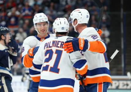 Oct 28, 2023; Columbus, Ohio, USA; New York Islanders center Kyle Palmieri (21) celebrates his goal with center Brock Nelson (29) and left wing Pierre Engvall (18) during the first period against the Columbus Blue Jackets at Nationwide Arena. Mandatory Credit: Joseph Maiorana-USA TODAY Sports