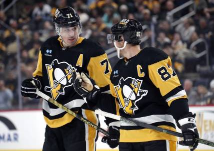 Oct 28, 2023; Pittsburgh, Pennsylvania, USA; Pittsburgh Penguins center Evgeni Malkin (71) listens to center Sidney Crosby (87) prior to a face-off against the Ottawa Senators during the first period at PPG Paints Arena. Mandatory Credit: Charles LeClaire-USA TODAY Sports