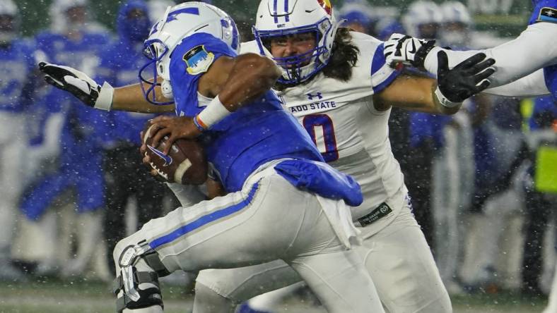 Oct 28, 2023; Fort Collins, Colorado, USA;  Colorado State Rams defensive lineman Grady Kelly (90) chases Air Force Falcons quarterback Zac Larrier (9) in the second quarter at Sonny Lubick Field at Canvas Stadium. Mandatory Credit: Michael Madrid-USA TODAY Sports