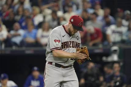 Oct 28, 2023; Arlington, TX, USA; Arizona Diamondbacks relief pitcher Merrill Kelly (29) reacts in the in the seventh inning against the Texas Rangers in game two of the 2023 World Series at Globe Life Field. Mandatory Credit: Raymond Carlin III-USA TODAY Sports