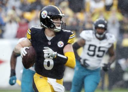 Oct 29, 2023; Pittsburgh, Pennsylvania, USA;  Pittsburgh Steelers quarterback Kenny Pickett (8) scrambles with the ball against the Jacksonville Jaguars during the first quarter at Acrisure Stadium. Mandatory Credit: Charles LeClaire-USA TODAY Sports