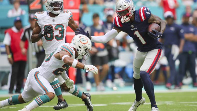 Oct 29, 2023; Miami Gardens, Florida, USA; New England Patriots wide receiver DeVante Parker (1) runs with the football against Miami Dolphins safety Brandon Jones (29) during the second quarter at Hard Rock Stadium. Mandatory Credit: Sam Navarro-USA TODAY Sports