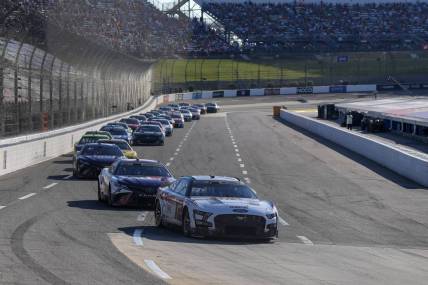 Oct 29, 2023; Martinsville, Virginia, USA; NASCAR Cup Series driver Ryan Blaney (12) leads the pack during the NASCAR Xfinity 500 at Martinsville Speedway. Mandatory Credit: David Yeazell-USA TODAY Sports