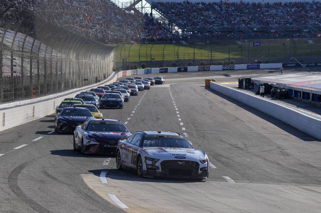 Oct 29, 2023; Martinsville, Virginia, USA; NASCAR Cup Series driver Ryan Blaney (12) leads the pack during the NASCAR Xfinity 500 at Martinsville Speedway. Mandatory Credit: David Yeazell-USA TODAY Sports