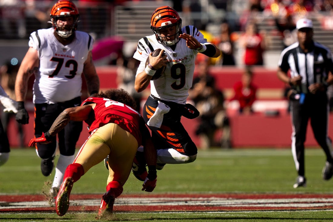 San Francisco 49ers safety Talanoa Hufanga (29) tackles Cincinnati Bengals quarterback Joe Burrow (9) in the second quarter of the NFL game between the Cincinnati Bengals and the San Francisco 49ers at Levi Stadium in Santa Clara, Calif., on Sunday, Oct 29, 2023.