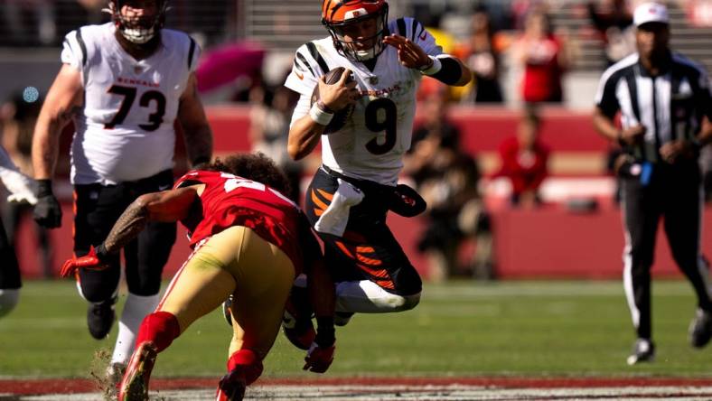 San Francisco 49ers safety Talanoa Hufanga (29) tackles Cincinnati Bengals quarterback Joe Burrow (9) in the second quarter of the NFL game between the Cincinnati Bengals and the San Francisco 49ers at Levi Stadium in Santa Clara, Calif., on Sunday, Oct 29, 2023.