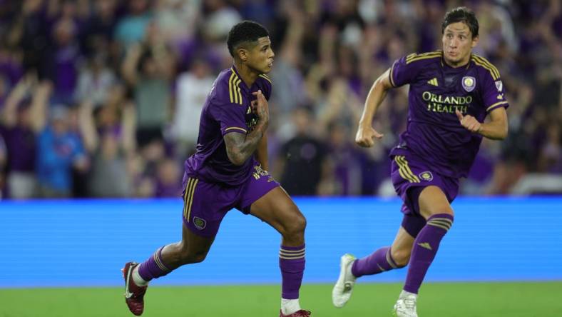 Oct 30, 2023; Orlando, Florida, USA; Orlando City midfielder Wilder Cartagena (16) celebrates a goal in the first half against the Nashville SC of game one in a round one match of the 2023 MLS Cup Playoffs at Exploria Stadium. Mandatory Credit: Nathan Ray Seebeck-USA TODAY Sports