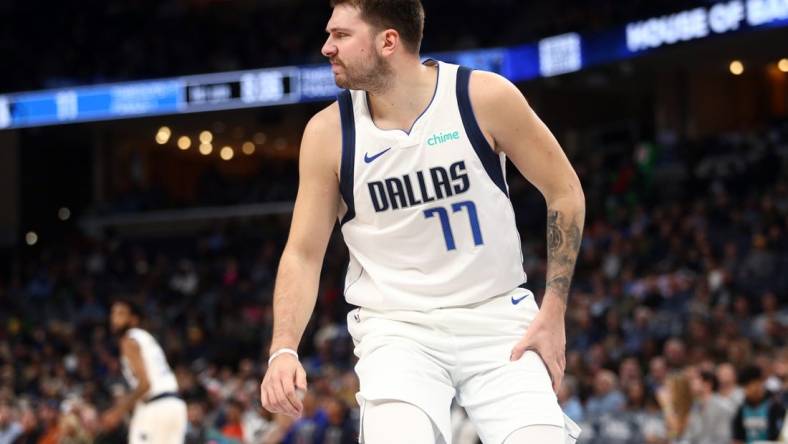 Oct 30, 2023; Memphis, Tennessee, USA; Dallas Mavericks guard Luka Doncic (77) reacts after being knocked down during the first half against the Memphis Grizzlies at FedExForum. Mandatory Credit: Petre Thomas-USA TODAY Sports