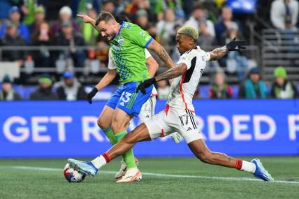 Oct 30, 2023; Seattle, Washington, USA; Seattle Sounders FC forward Jordan Morris (13) is challenged by FC Dallas defender Nkosi Tafari (17) during the second half of game one in a round one match of the 2023 MLS Cup Playoffs at Lumen Field. Mandatory Credit: Steven Bisig-USA TODAY Sports