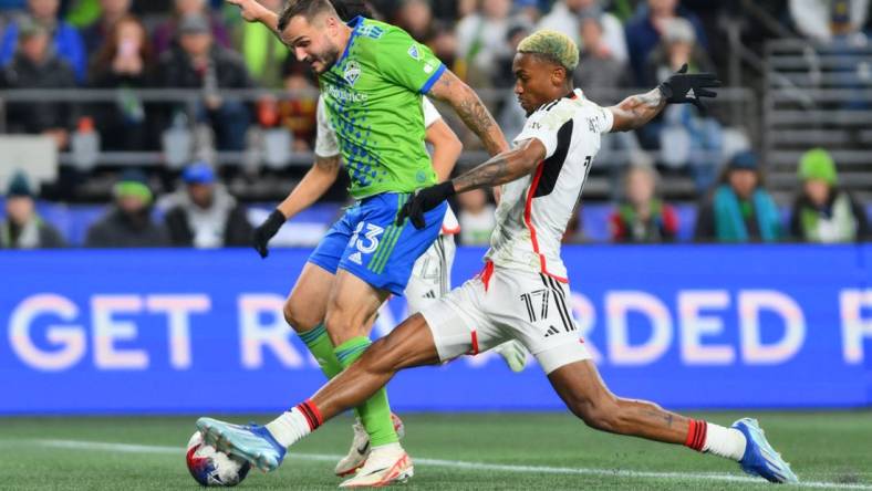 Oct 30, 2023; Seattle, Washington, USA; Seattle Sounders FC forward Jordan Morris (13) is challenged by FC Dallas defender Nkosi Tafari (17) during the second half of game one in a round one match of the 2023 MLS Cup Playoffs at Lumen Field. Mandatory Credit: Steven Bisig-USA TODAY Sports