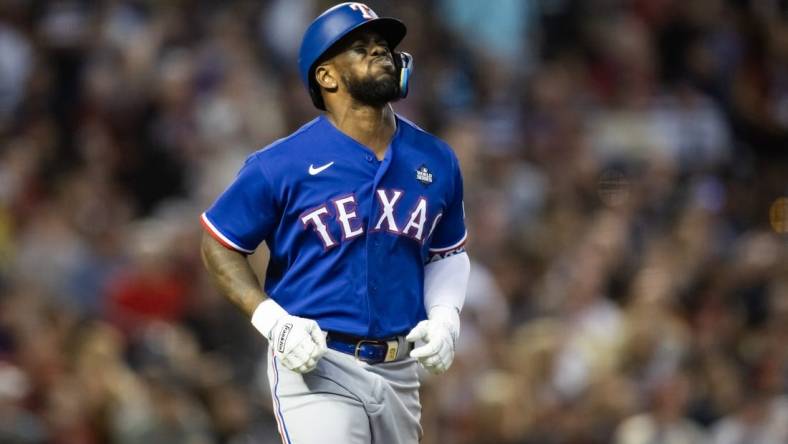 Oct 30, 2023; Phoenix, AZ, USA; Texas Rangers right fielder Adolis Garcia (53) reacts after after suffering an injury in the eighth inning of game three of the 2023 World Series against the Arizona Diamondbacks at Chase Field. Mandatory Credit: Mark J. Rebilas-USA TODAY Sports