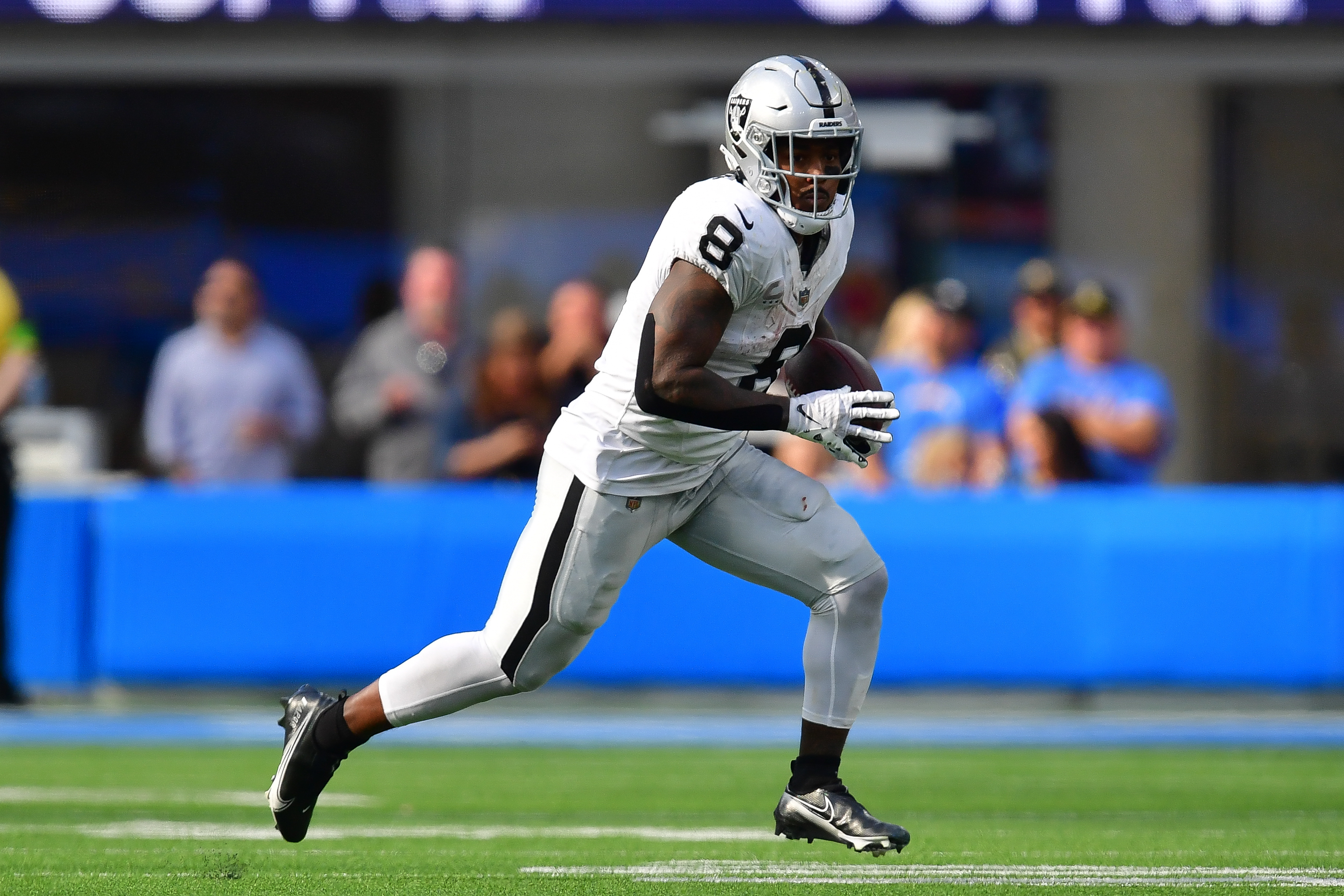 Las Vegas Raiders running back Josh Jacobs (28) smiles as he walks toward  the bench in the 4th …