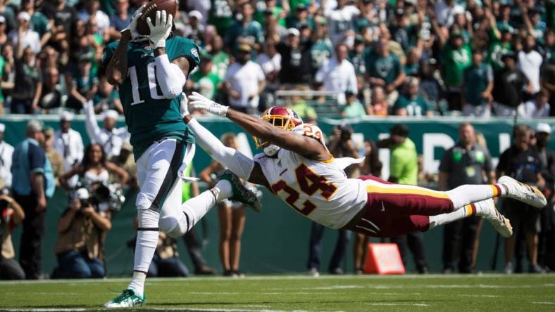 Eagles' DeSean Jackson (10) brings in a deep pass in front of a diving Josh Norman (24) to score Sept. 8 at Lincoln Financial Field.

Sports Eagles Redskins